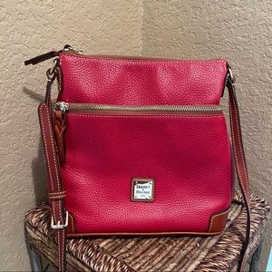 Elegant red leather vintage Dooney and Burke Purse in excellent condition.